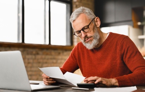 A man reading some paperwork.
